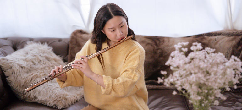 A woman playing a flute. 