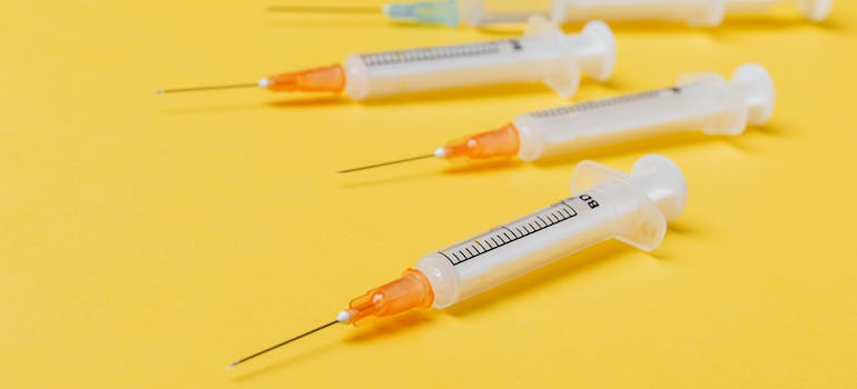 Syringes on a yellow background