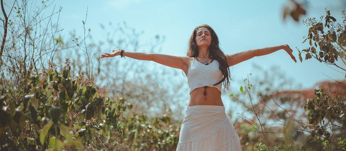 Woman meditating as a way of spending a mental health day.