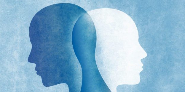 Blue and white shapes of a head representing dual diagnoses of PTSD and Substance Use Disorder