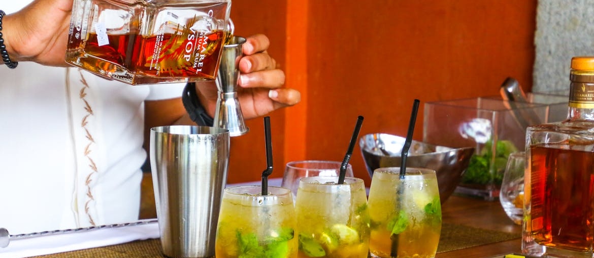 Man pouring alcohol.