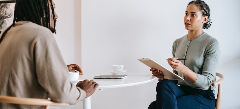 a woman counseling a young man 
