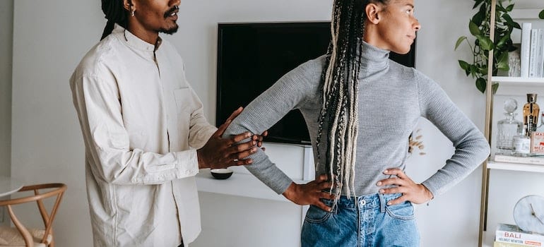 A black man seeking forgiveness from his offended girlfriend.