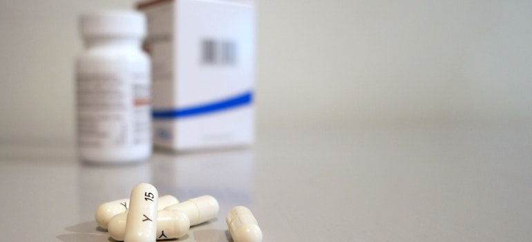 a pile of pills a pill bottle in a rehabilitation treatment center