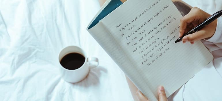 Person writing in a diary.