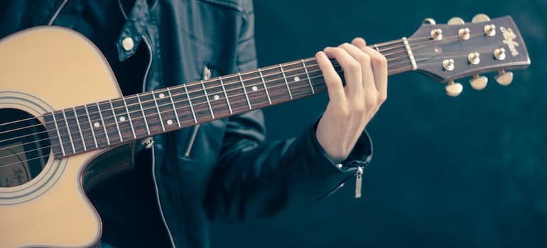 Person playing guitar.