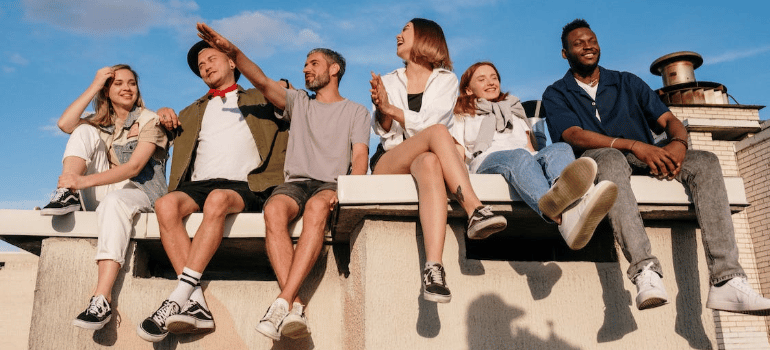 A group of friends hanging out outdoors.