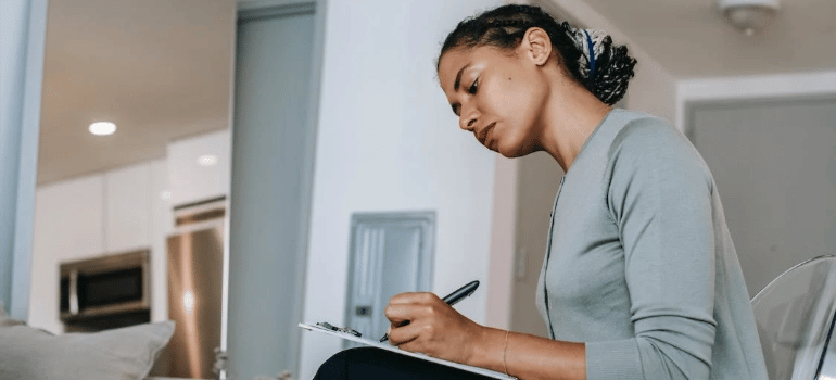 A therapist taking notes during a session.