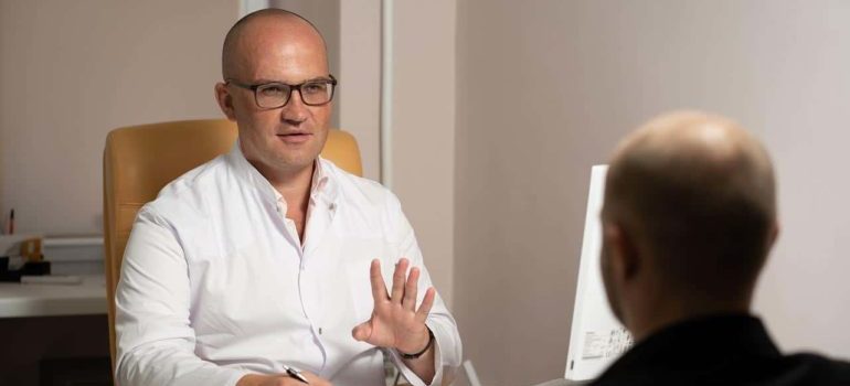 A doctor and a patient discussing in an office.