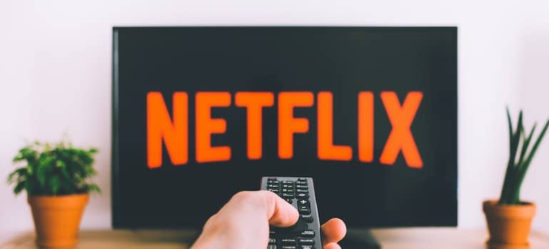 Person watching Netflix as a way to control anxiety during cocaine rehab in WV