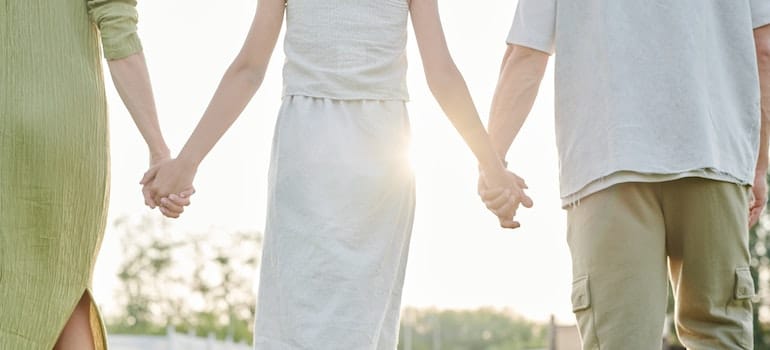 Family holding hands.