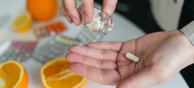 Person taking medication at a residential treatment center West Virginia