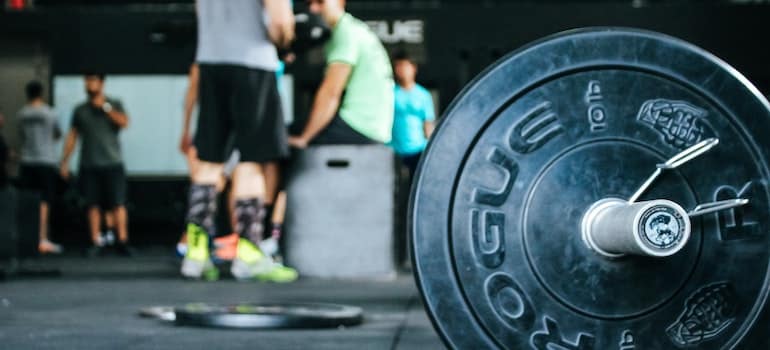 Guys talking in a gym.