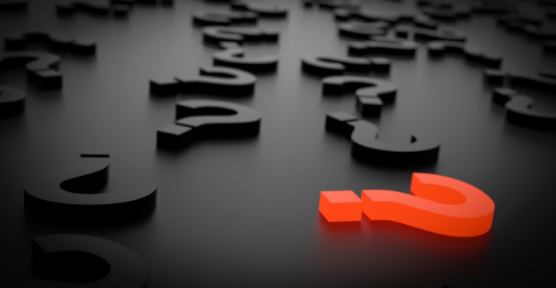 An illustration of a red question mark sign among black ones on a black surface.