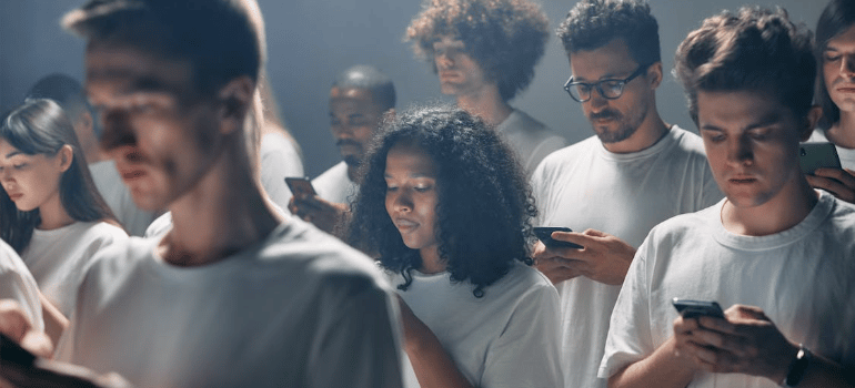 People in white shirts using smartphones.