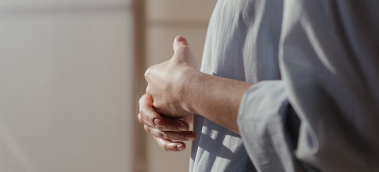 Person wringing their hands.