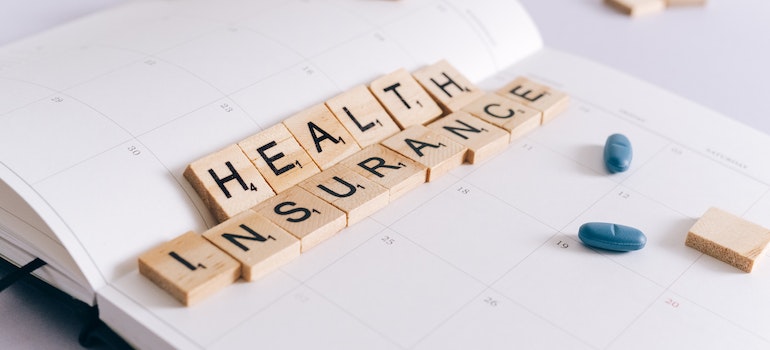 Scrabble letters that spell health insurance.