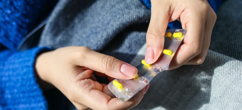 Person Holding Blister Pack