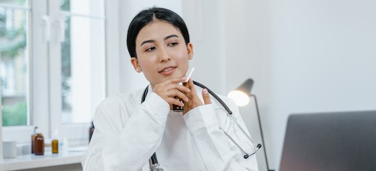 A healthcare provider sitting at the table