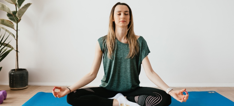 a woman meditating at a rehab Morgantown WV center