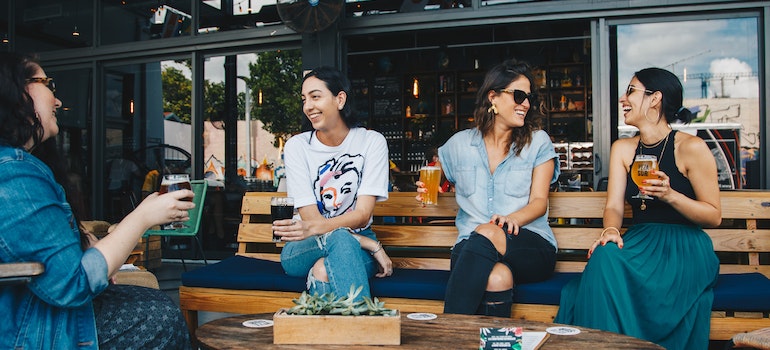 A group of young women drinking without recognizing an addiction problem