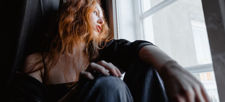Person sitting in a window in long term drug rehab WV.