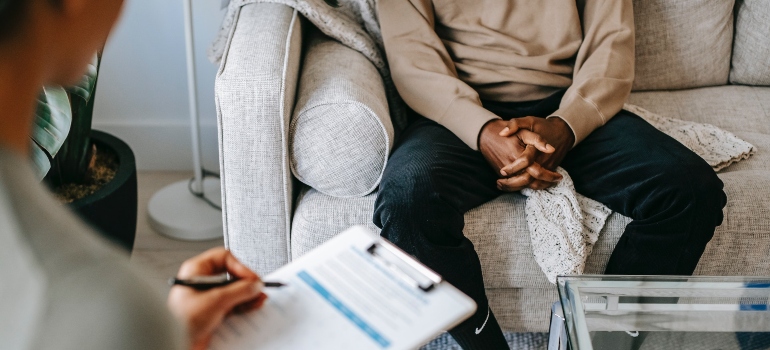 patient and therapist during REBT for addiction