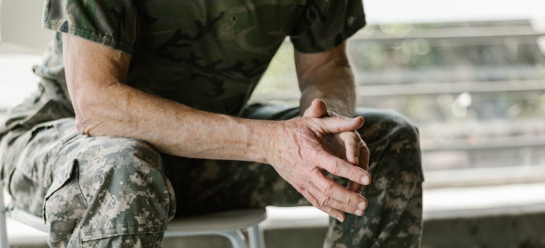unrecognizable man in military uniform