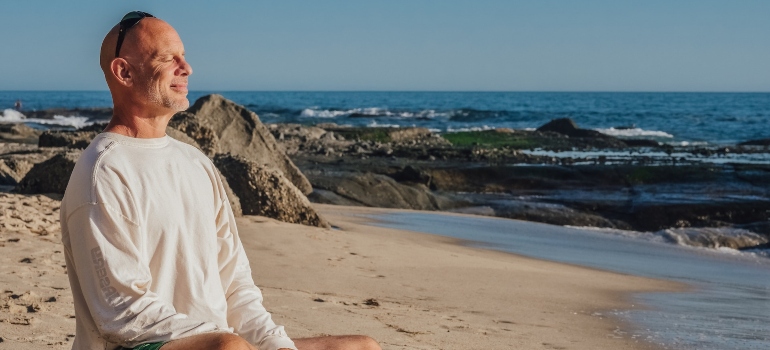 elder man enjoying time at the beach