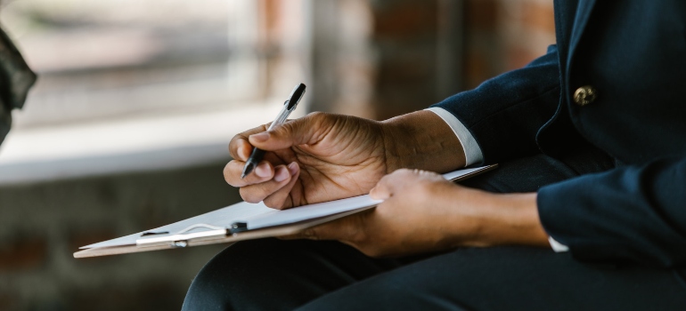 counselor facilitating group therapy for addiction