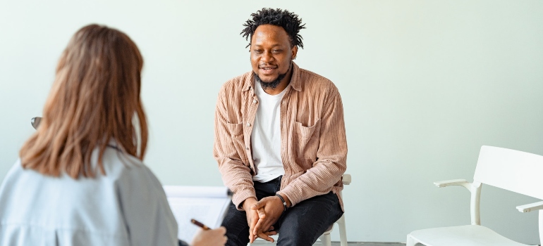 black man taking to a counselor