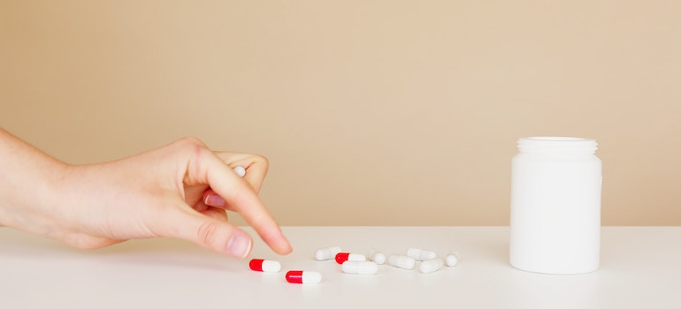A person taking medications.