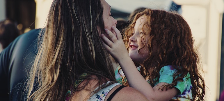 A mother holding her daughter