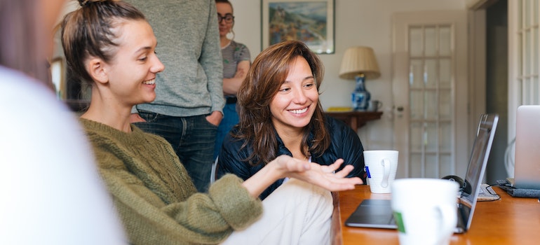 A family using a laptop and reading about the benefits of family therapy for addiction