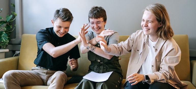 Three young people hanging out.