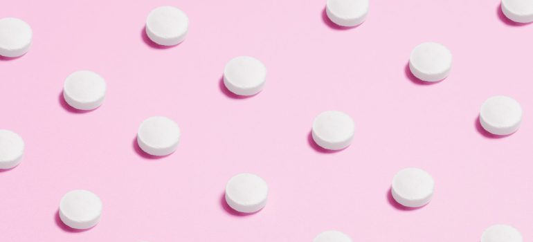 Stimulant pills arranged in several rows.