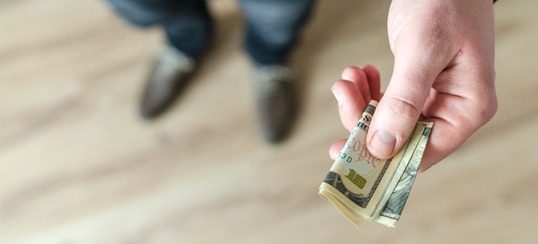 person holding a  bill