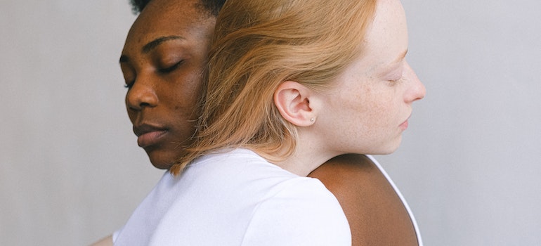 women hugging each other