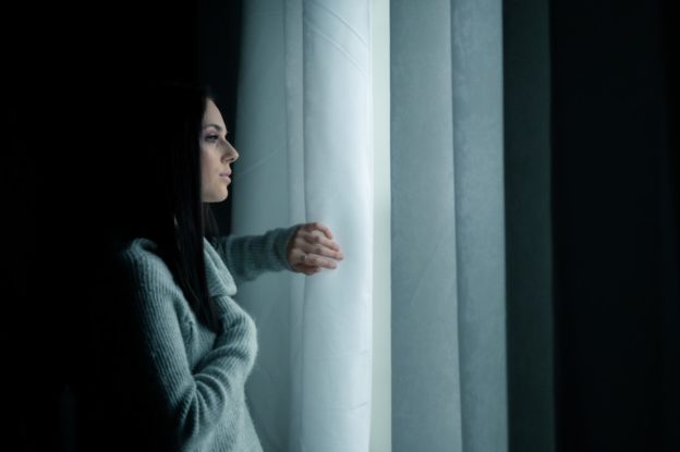 a girl looking through the window