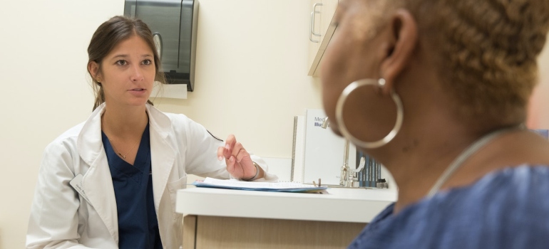 a doctor assisting a patient in finding acceptance on your recovery journey