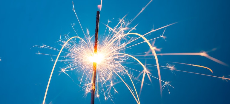 A lit sparkler representing potential triggers during addiction recovery.
