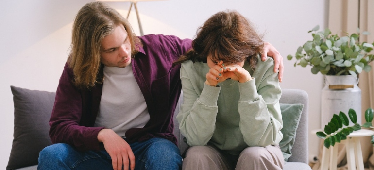 a man consoling a friend
