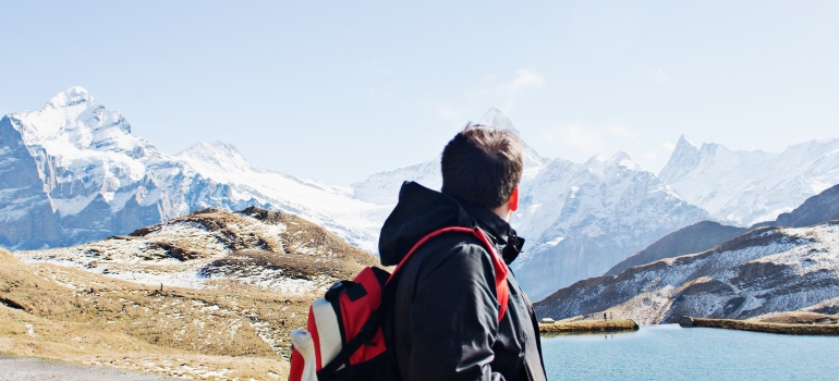 man hiking outdoors as a way of coping with loss during your sober journey
