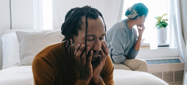 bored couple sitting in the room