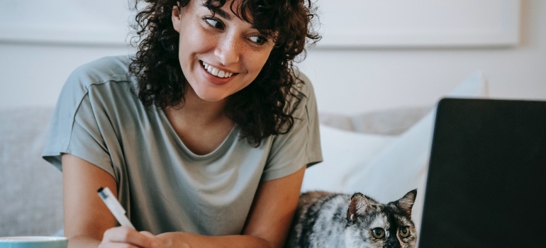 happy woman listening to an online course about obstacles to making positive changes in life