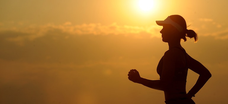 A person running at dusk