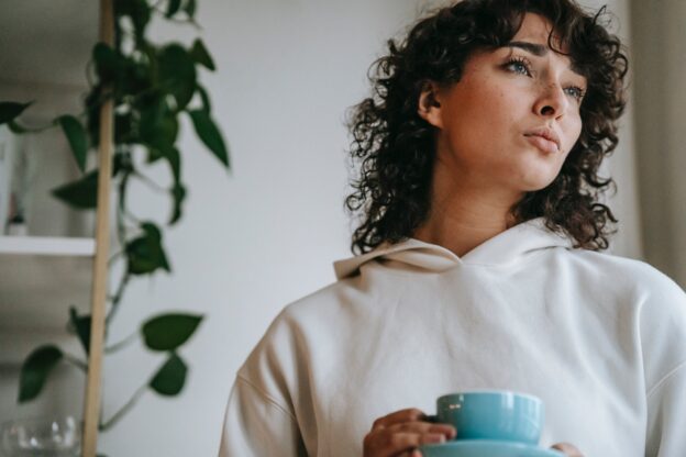 woman drinking her tea and discussing unique needs women face in recovery