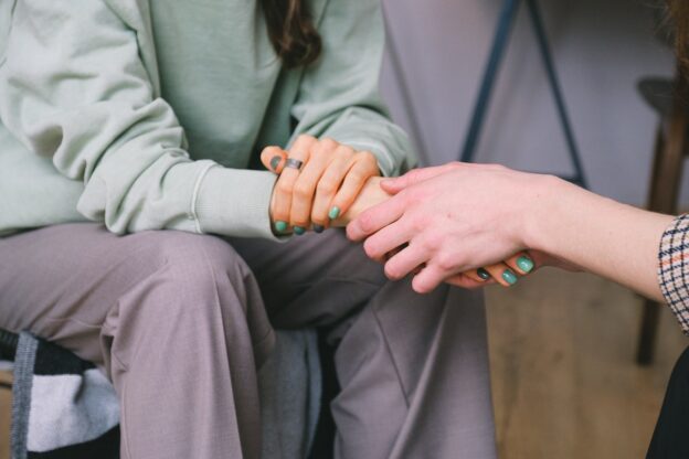 A person trying to talk about addiction with someone they love