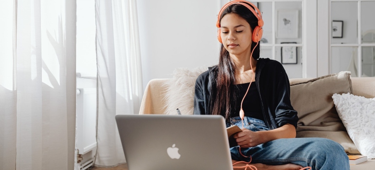 focused girl listening to online lectures about the role of schools in combating illicit substance abuse