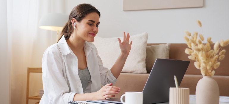 happy woman talking online about rebuilding your life after addiction treatment in WV